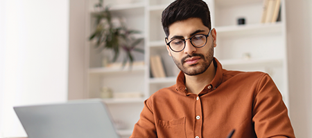 man studying on computer